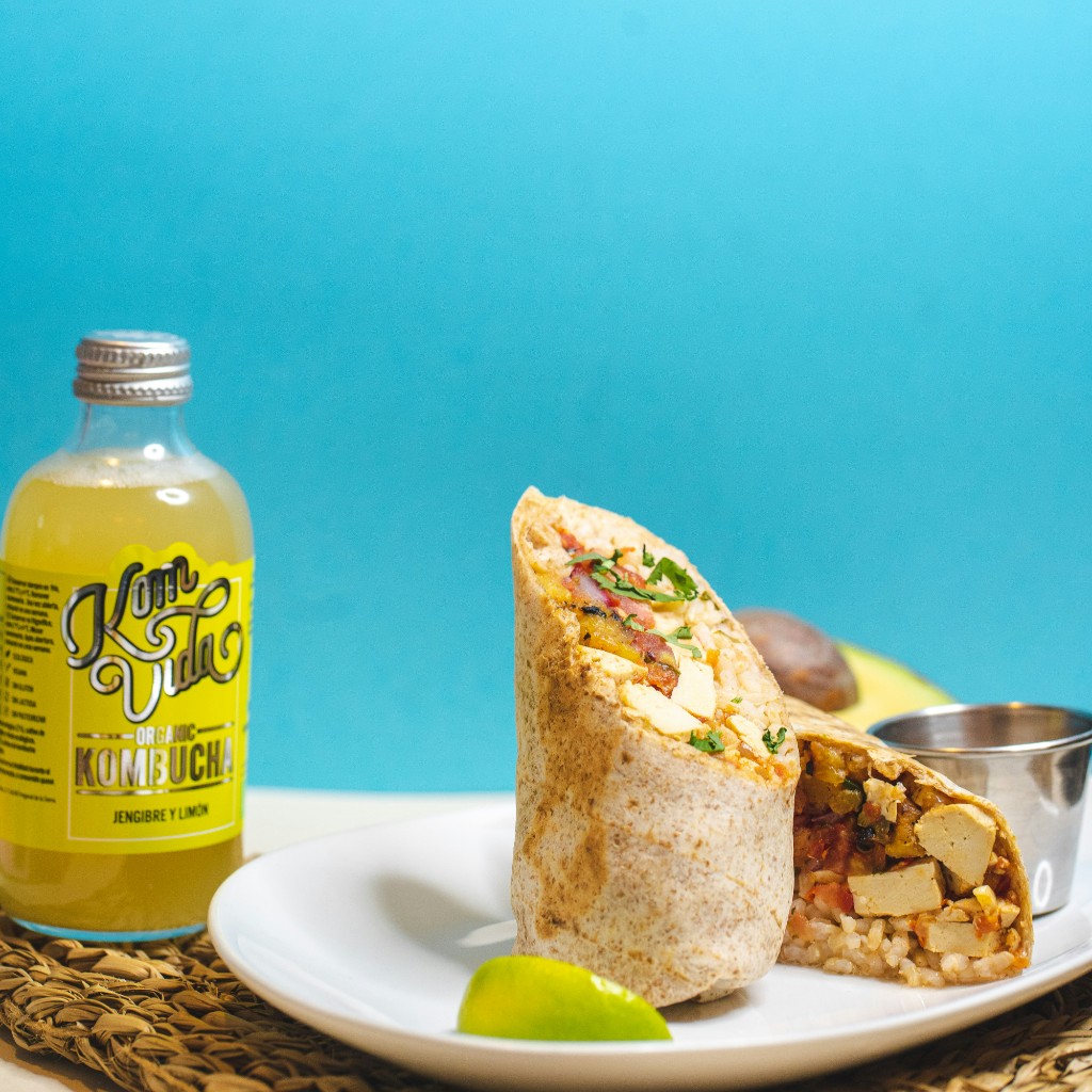 Golden Tortilla Burrito cut in half on a plate